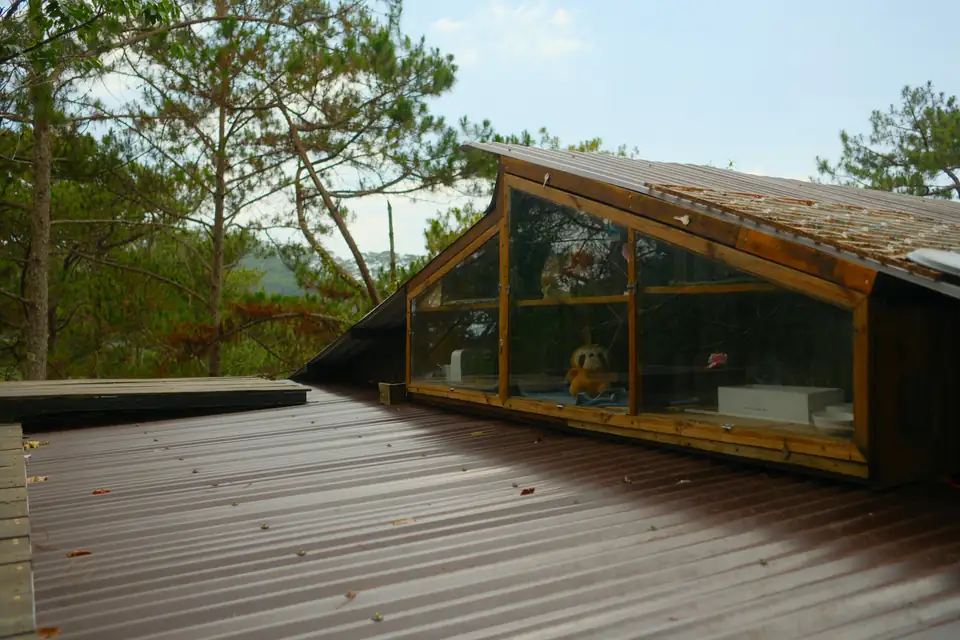 Glazed garden pavilion with an angled roof and deck, an idea for larger Gosforth gardens